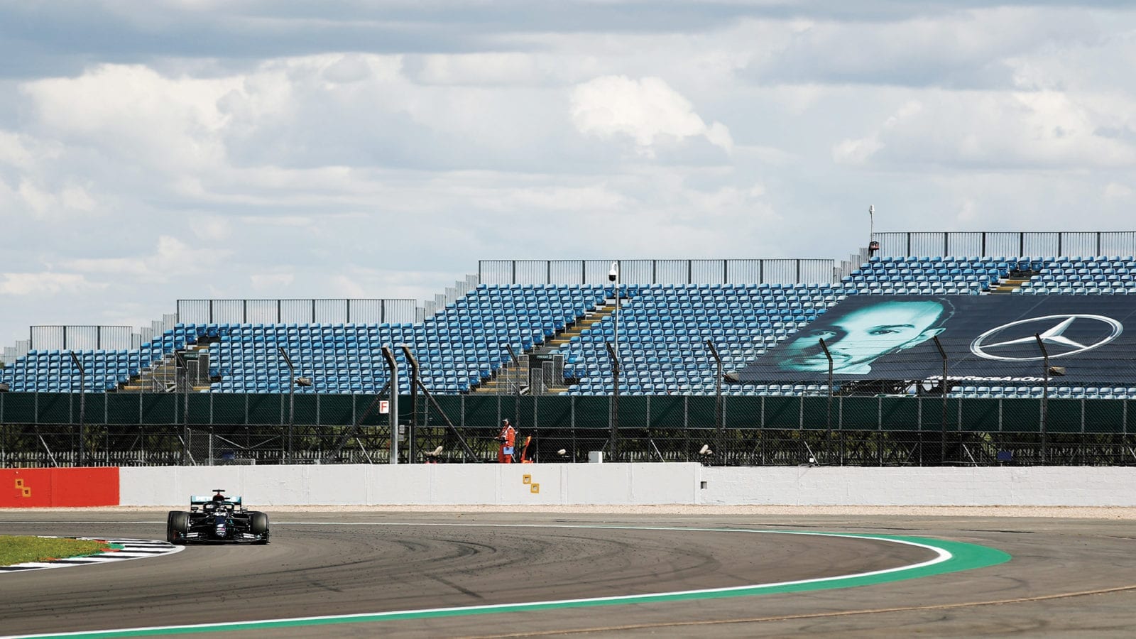 Lewis Hamilton racing in front of empty grandstands at Silverstone in 2020