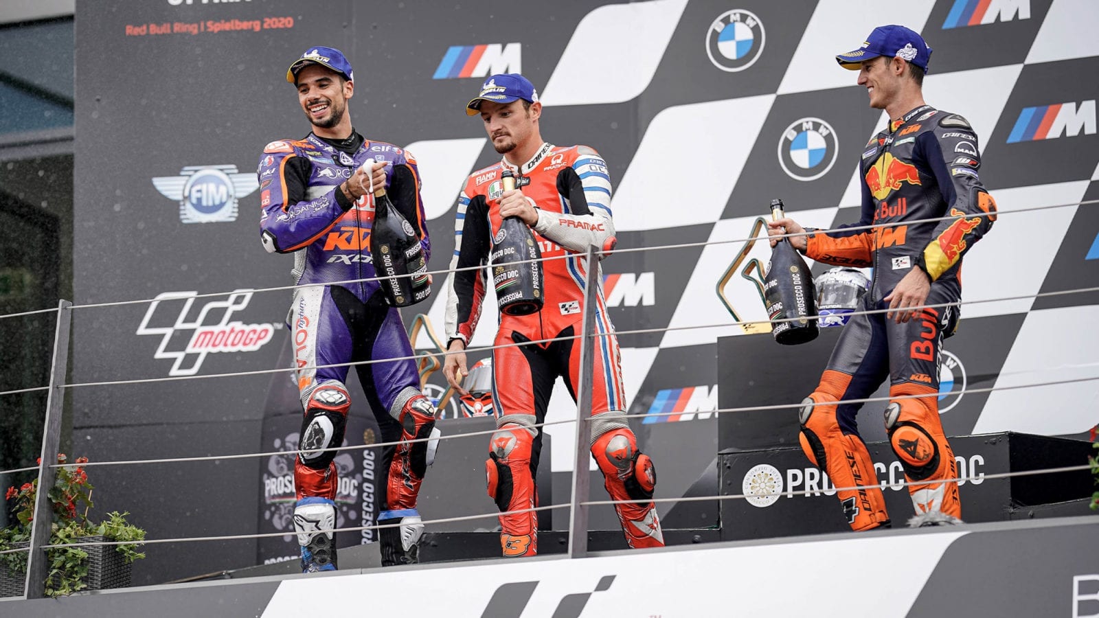 Miguel Oliveira Jack Miller and Pol Espargaro on the MotoGP podium at the Red Bull ring ater the 900th premier class motorcycle grand prix