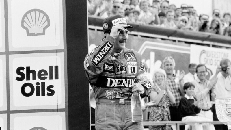 Nigel Mansell celebrates on the podium at the 1987 British Grand Prix at Silverstone