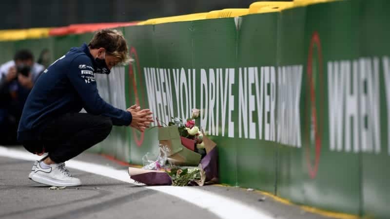 Pierre Gasly lays flowers at Spa Francorchamps in 2020 at the spot where Anthoine Hubert was killed
