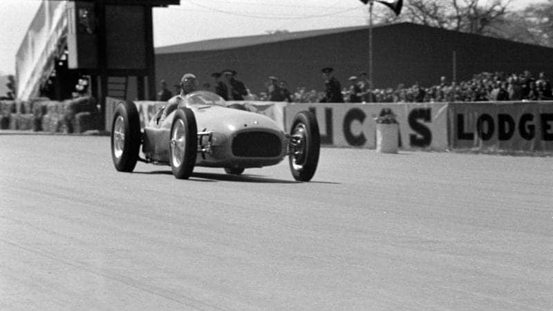 Raymond Mays demonstrates a BRM V16 before the start of the Grand Prix during the British GP at Silverstone on May 13, 1950 in Silverstone