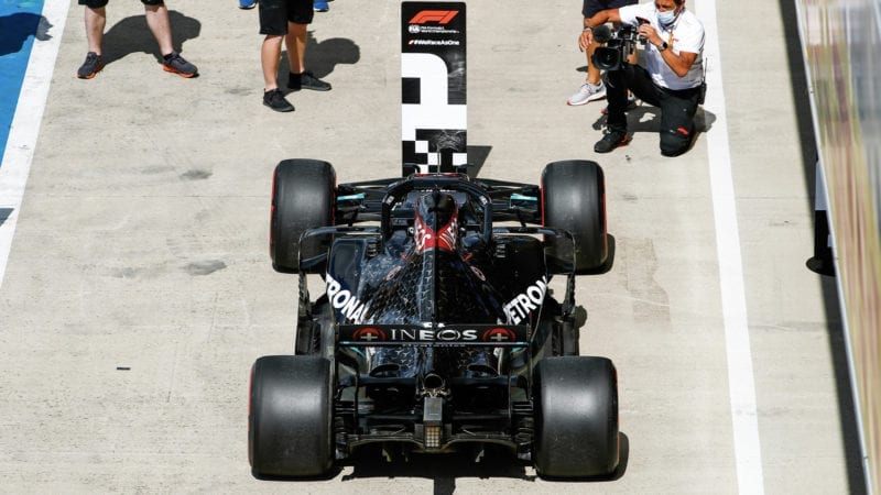 Rear view of Lewis Hamilton's Mercedes W11 in front of the number 1 board after qualifying on pole for the 2020 F1 British Grand Prix at Silverstone