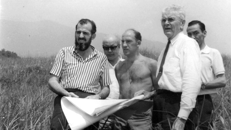 Stirling Moss and Don Nichols looking at plans for the Fuji Speedway in Japan