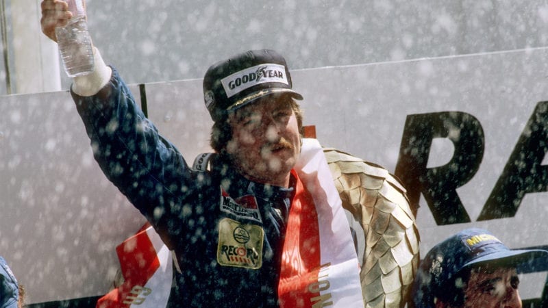 Keke Rosberg on the podium after winnng the 1982 Grand Prix of Switzerland at Dijon