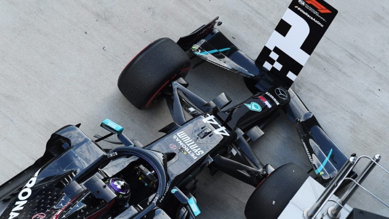 Lewis Hamilton parks his Mercedes in front of the number 1 board after qualifying on pole for the 2020 F1 Russian Grand prix