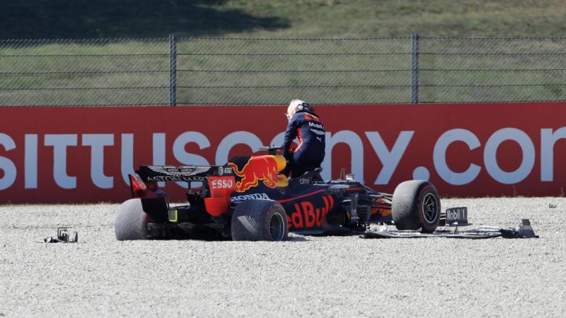 Max Verstappen climbs out of his Red Bull after crashing out of the 2020 F1 TUscan Grand Prix at Mugello