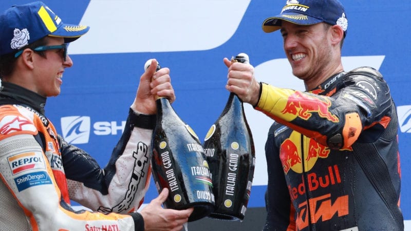 Alex Marquez and Pol Espargaro celebrate on the podium at Le Mans after the 2020 MotoGP French Grand Prix