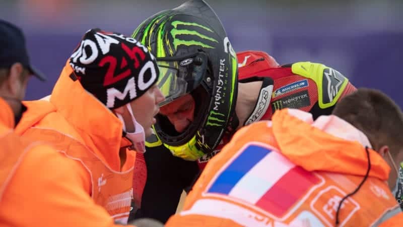Cal Crutchlow is helped by marshals after crashing out of the 2020 MotoGP French Grand Prix at Le Mans