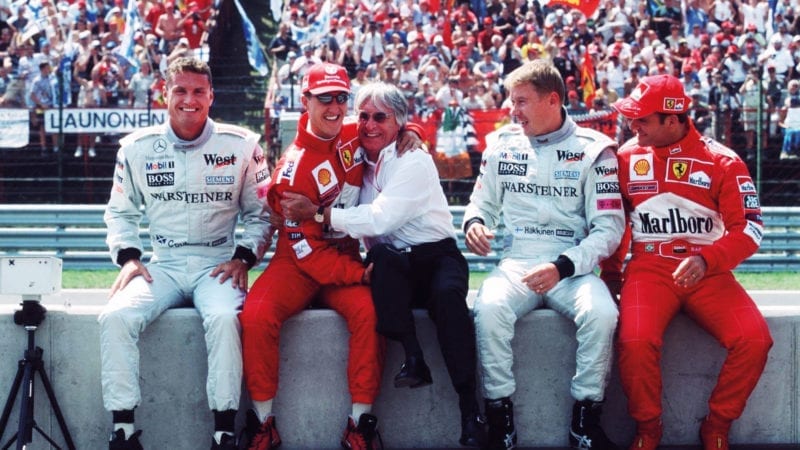 David Coulthard, Michael Schumacher, Bernie Ecclestone, Mika Hakkinen and Rubens BArrichello on the pitwall at the 2000 Hungarian Grand Prix