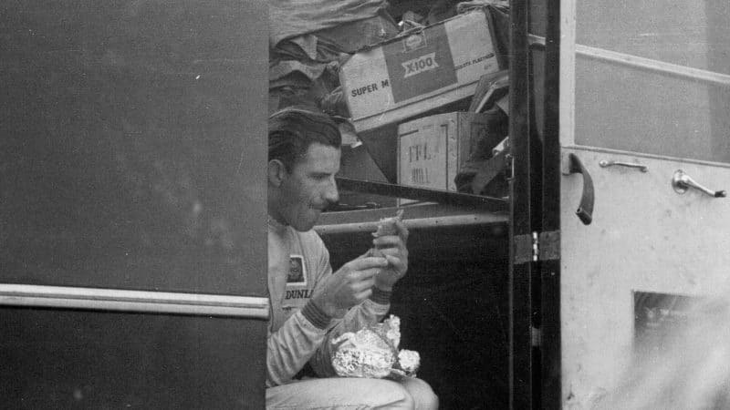 Graham Hill in the Maranello Concessionaires truck at Goodwood for the 1964 Sussex Trophy