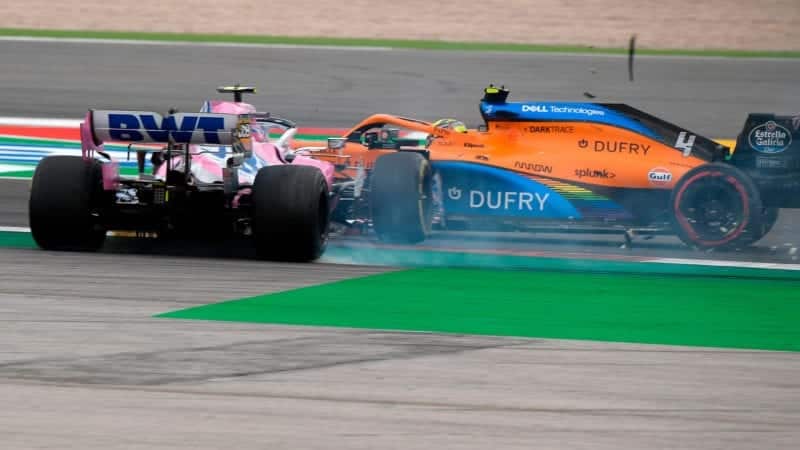 Lance Stroll spins off the Portimao track after colliding with Lando Norris' McLaren during the 2020 Portuguese Grand Prix