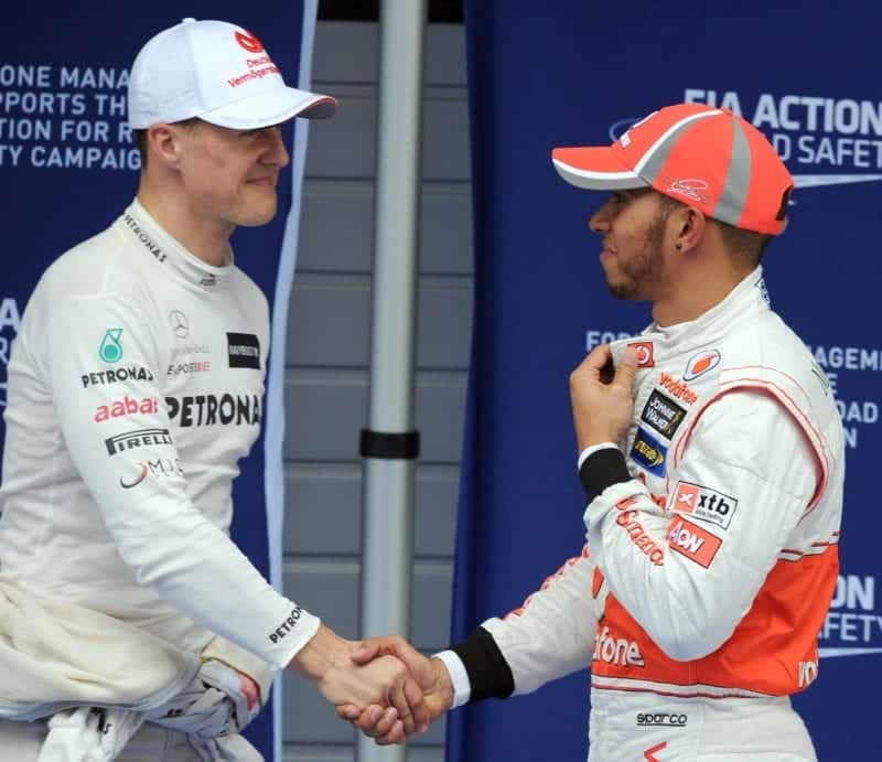 Lewis-Hamilton-and-Michael-Schumacher-shake-hands-in-Shanghai-ahed-of-the-2012-Chinese-Grand-Prix