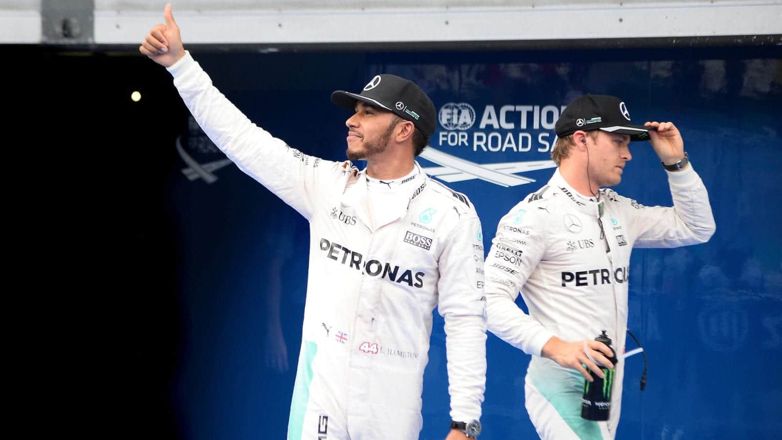 Lewis Hamilton and Nico Rosberg look in opposite directions after qualifying for the 2016 Malaysian Grand Prix