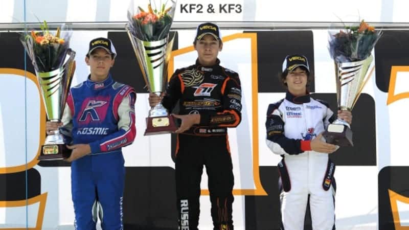 Luca Corberi alongside European Championship race winner George Russell and Petru Gabriel Florescu on the podium at the PF karting circuit in Grantham in 2012