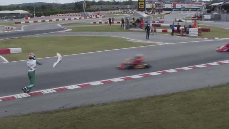 Luca Corberi throws the front bumper of his kart onto the track during the 2020 FIA KZ World Championship