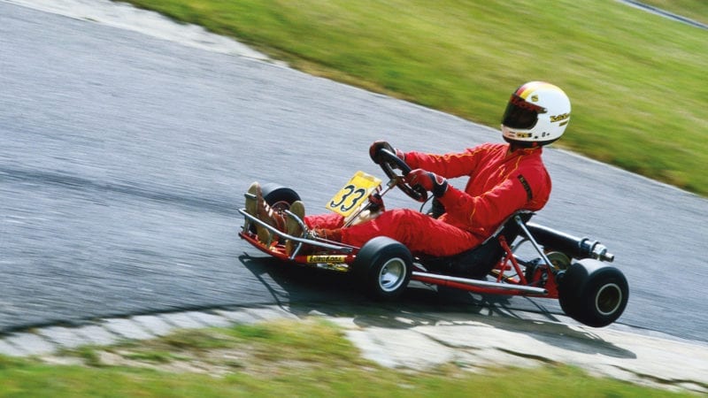 Michael Schumacher karting with two wheels off the ground