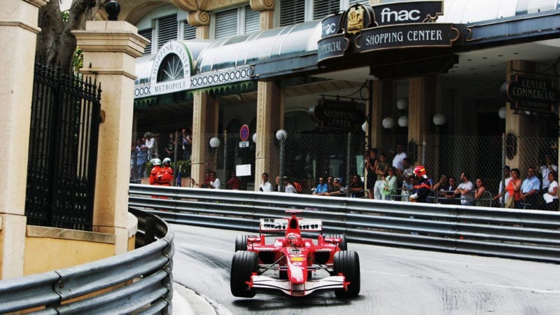 Michael Schumacher's Ferrari with the frint left wheel off the ground at Monaco in 2006