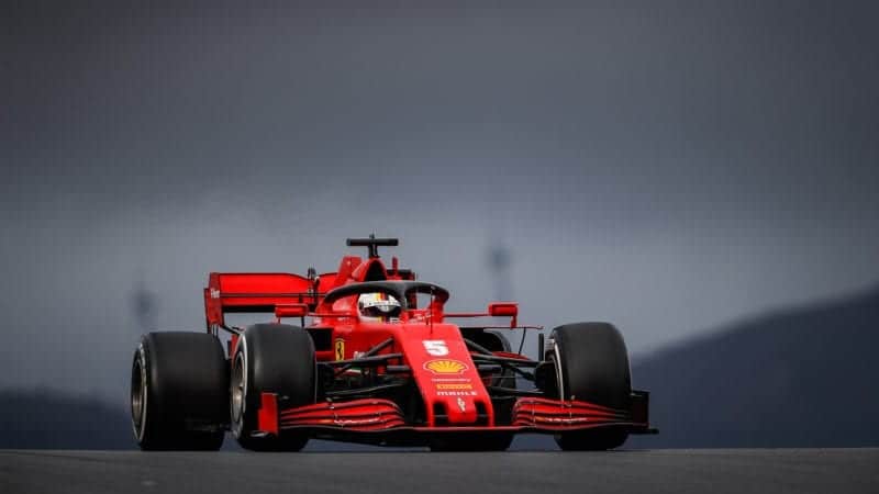Sebastian Vettel driving under a stormy sky at the 2020 F1 Portuguese Grand Prix at Portimao