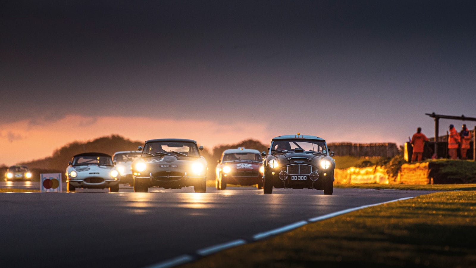 Stirling Moss Memorial Trophy race in the dusk at Goodwood SpeedWeek