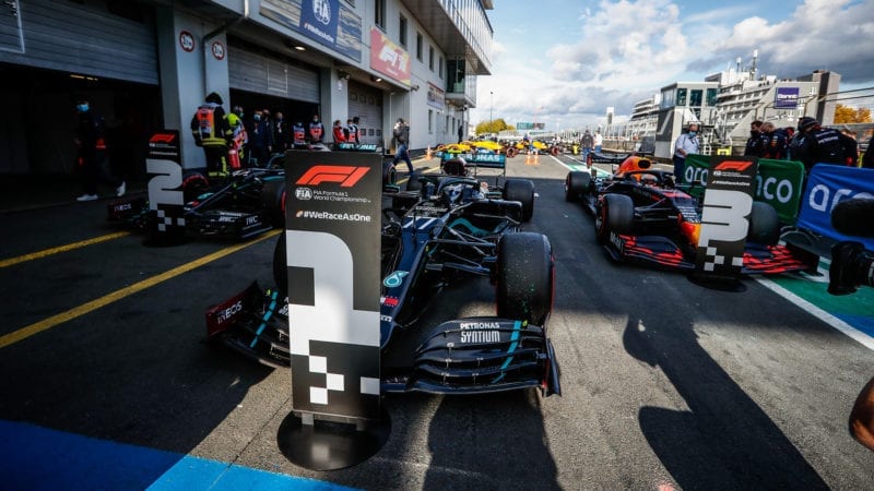 Valtteri Bottas Lewis Hamilton and Max Verstappen's cars in parc ferme after qualifying at the Nurburgring for the 2020 F1 Eifel Grand Prix