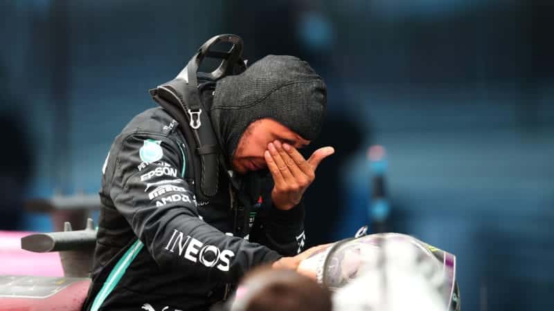 An emotional Lewis Hamilton wipes his eyes after winning the 2020 f1 Turkish Grand Prix