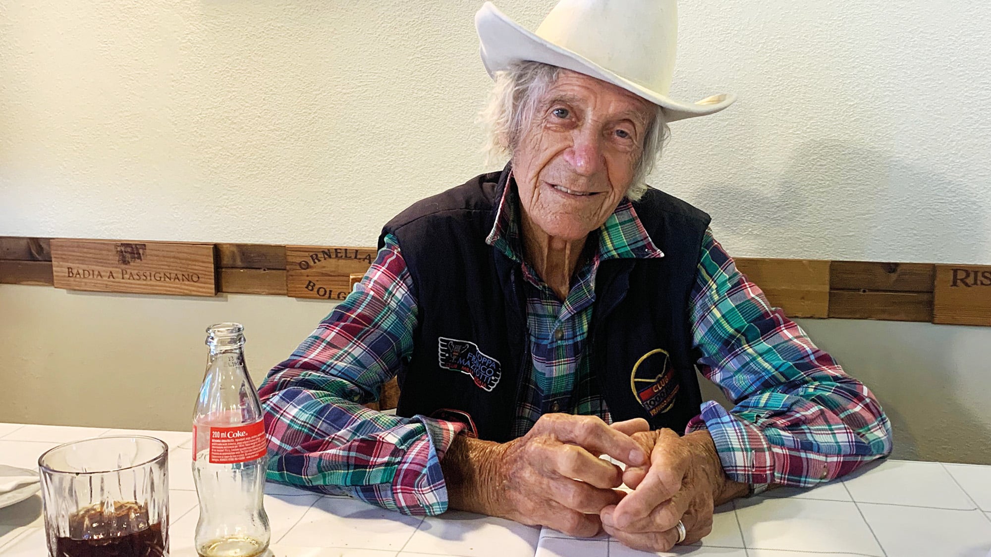 Arturo Merzario sits in a cafe in 2020