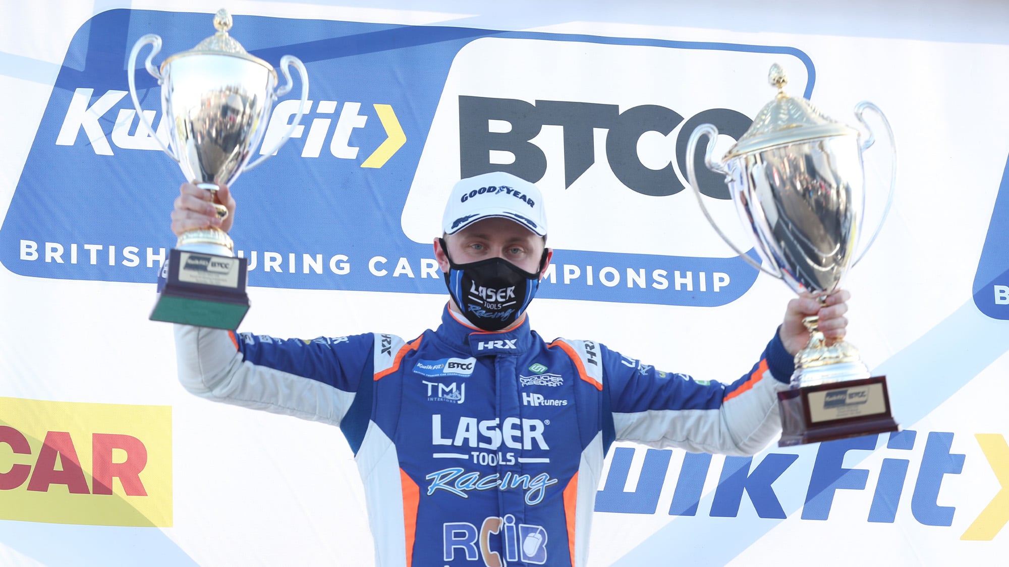 Ash Sutton holds up his trophies at the 2020 BTCC Brands Hatch Indy round