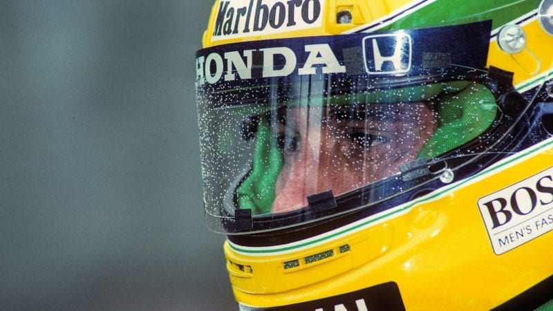 Ayrton Senna wearing a helmet with raindrops on the visor