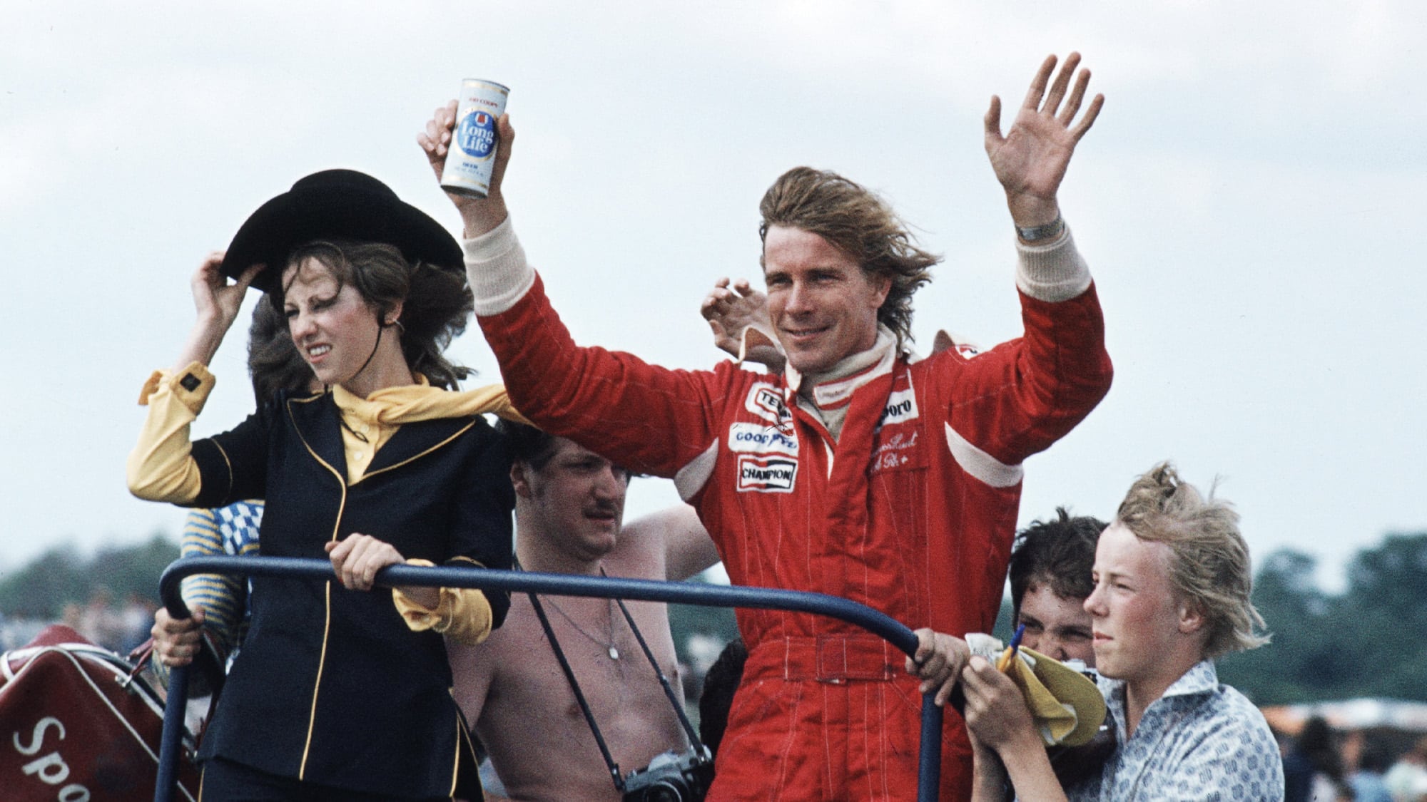 James Hunt celebrates winning the 1977 F1 British Grand Prix at Silverstone with a can of beer