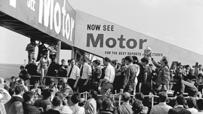 Jim Clark in the middle of the crowd after winning the 1967 British Grand Prix