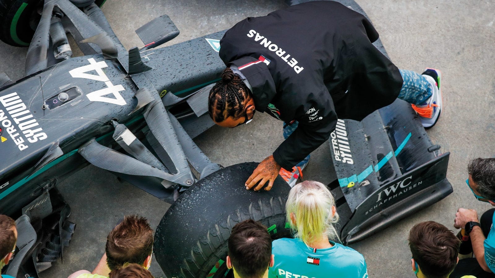 Lewis Hamilton examines his smooth intermediate tyres after winning the 2020 F1 Turkish Grand Prix at Istanbul Park