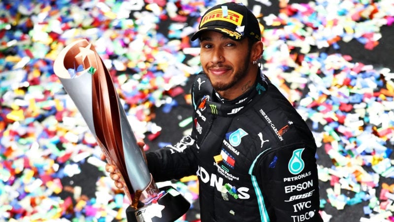 Lewis Hamilton holds the winner's trophy from the 2020 F1 Turkish Grand Prix where he won his 7th F1 world championship