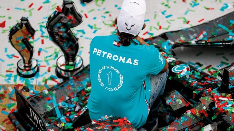 Lewis Hamilton sits on his Mercedes at Imola after a win in the 2020 Emilia Romagna Grand Prix clinched a 7th F1 constructors championship for Mercedes