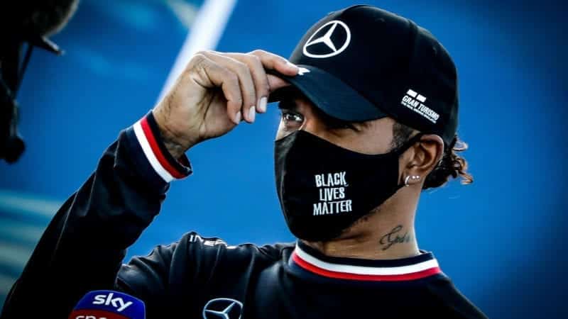 Lewis Hamilton wearing a Mercedes cap and Black Lives Matter mask