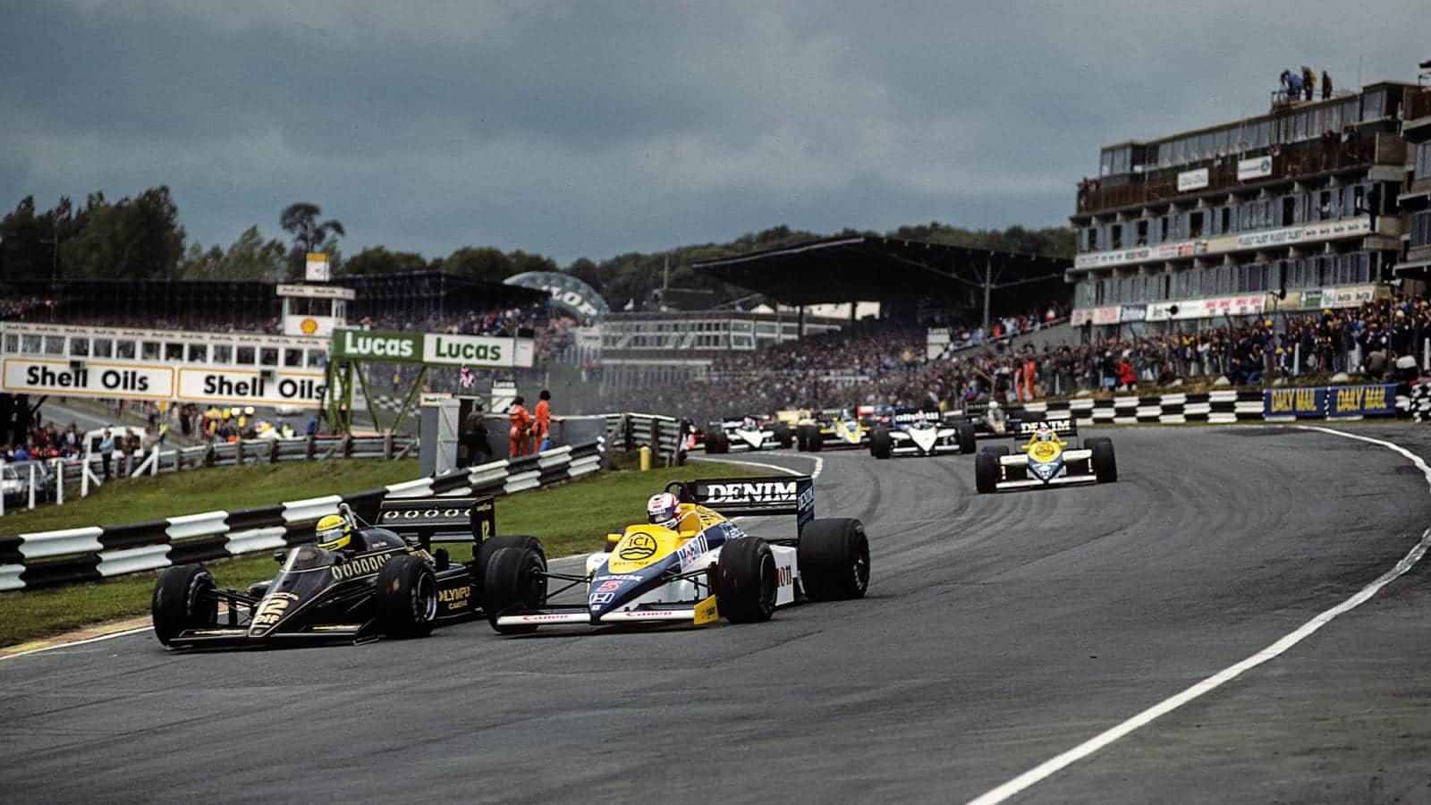 Nigel Mansell battles with Ayrton Senna on his way to victory at the 1985 British Grand Prix at Brands Hatch
