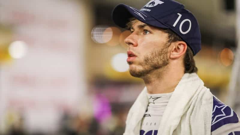Pierre Gasly watches a replay of Romain Grosjean's crash at the 2020 F1 Bahrain Grand Prix
