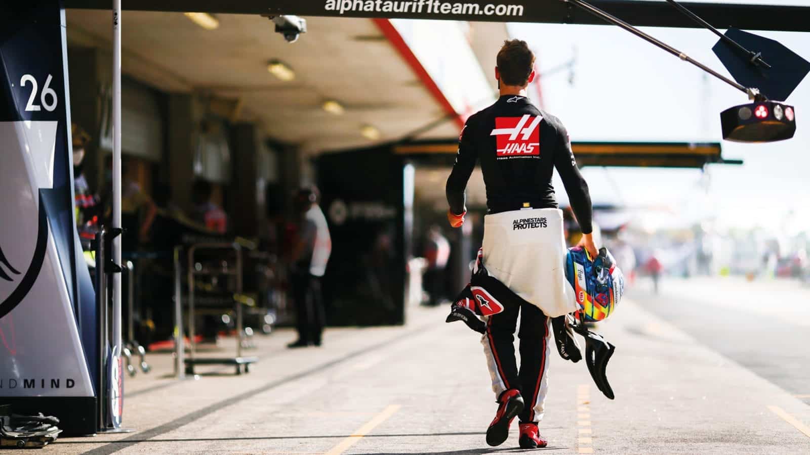 Romain Grosjean walks down the pitlane during the 2020 F1 season