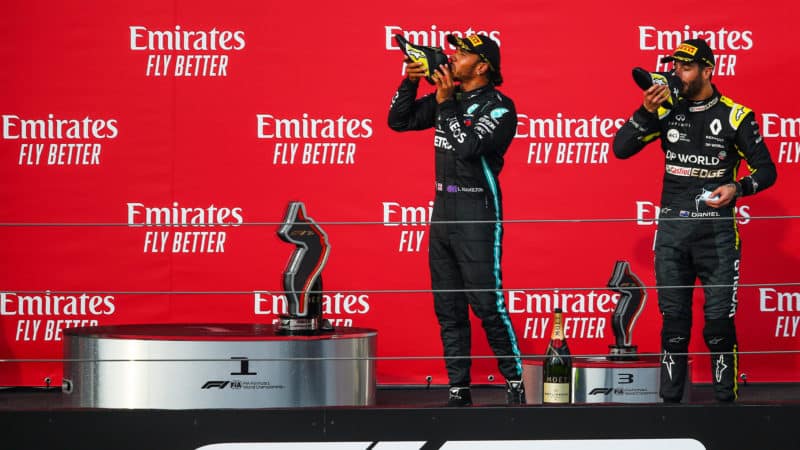Shoey - Lewis Hamilton and Daniel Ricciardo drink champagne from race shoes on the podium at Imola after the 2020 F1 Emilia Romagna Grand Prix