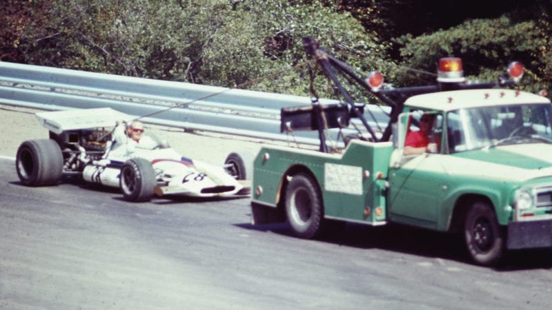 John Cannon and his BRM P153 being towed back to the pits at Watkins Glen during the 1971 United States Grand Prix