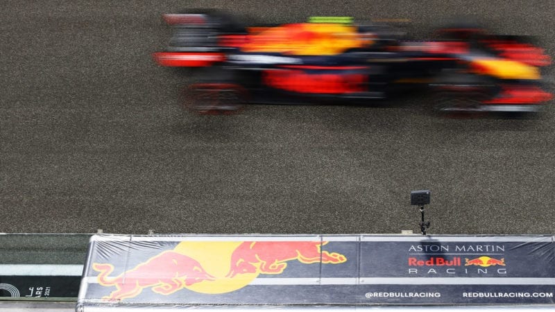 Alex Albon's Red Bull is a blur as it passes the pitwal at the 2020 Abu Dhabi GP