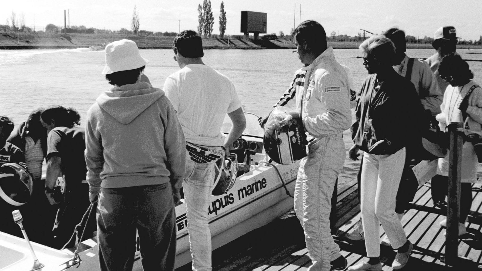 Derek Warwick and Patrick Tambay board a boat for the 1986 Canadian Grand Prix