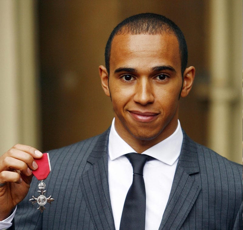 Lewis Hamilton collectes his MBE from Buckingham Palace