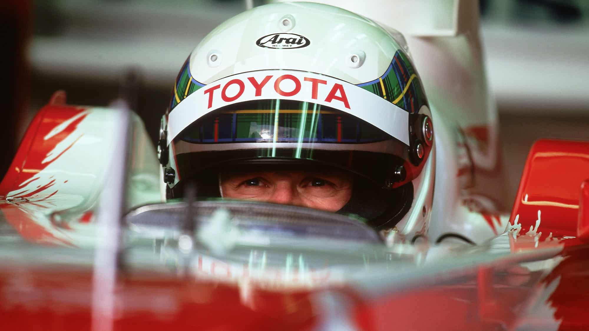 Scottish formula 1 driver Allan McNish watches the results in his Toyota which will compete this year during the F1 world championship 09 January 2002, at a private practice session in Montmello circuit of Catalunya. AFP PHOTO/CHRISTOPHE SIMON (Photo by Christophe SIMON / AFP) (Photo by CHRISTOPHE SIMON/AFP via Getty Images)