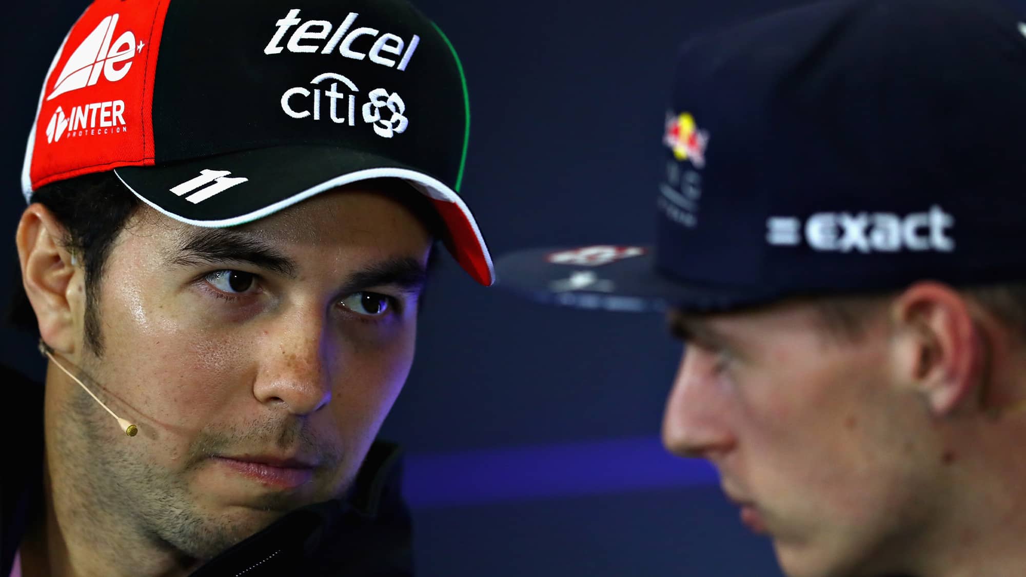 Sergio Perez looks towards Max Verstappen