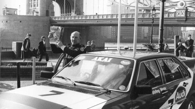 Stirling Moss at Tower Bridge with Speed comic