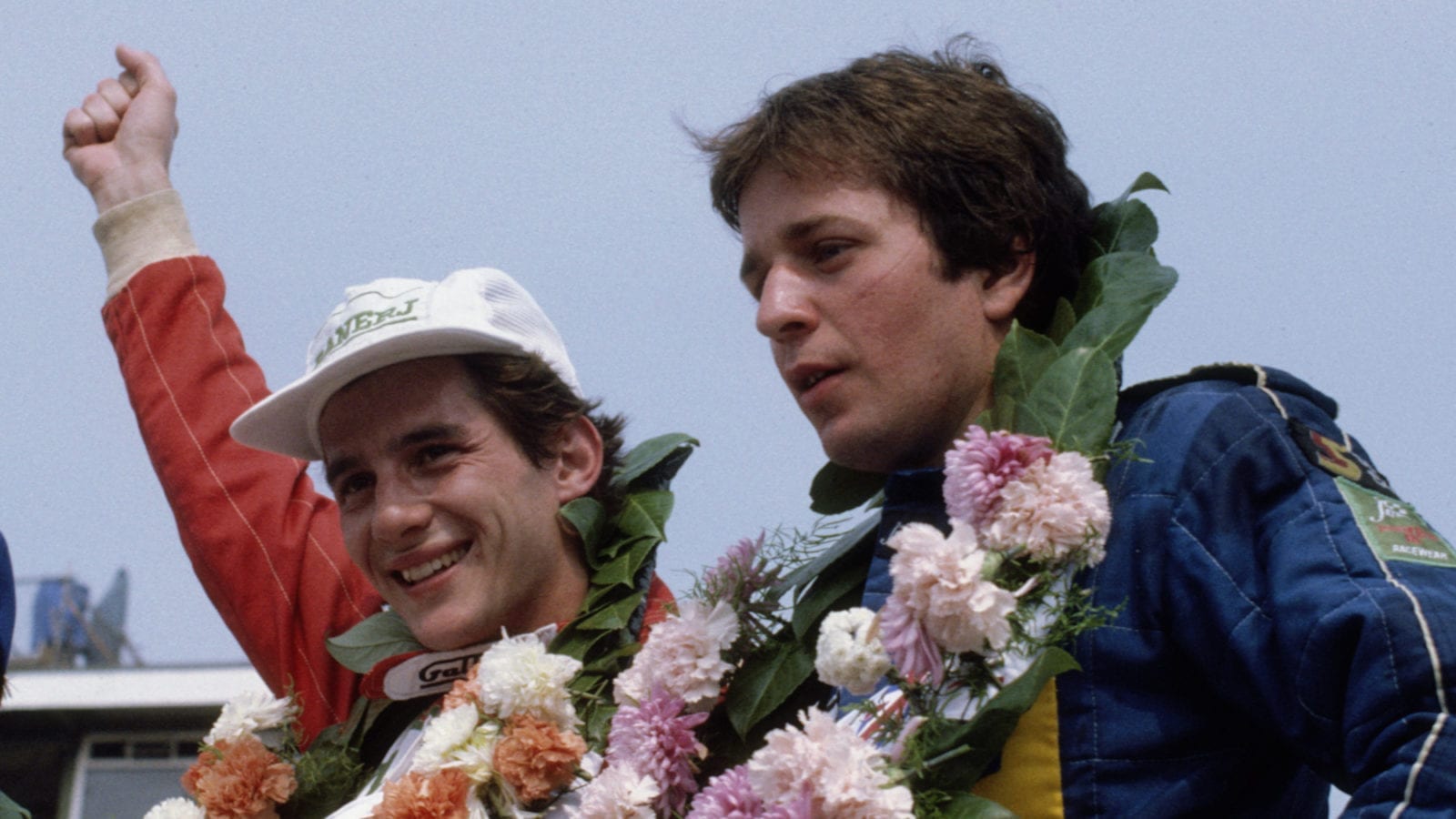 Ayrton Senna celebrates winning the 1983 British F3 championship at Silverstone next to Martin Brundle