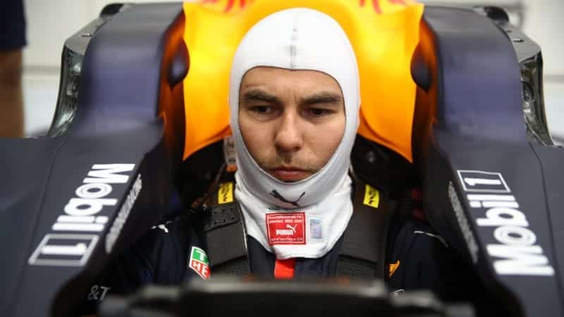 Sergio Perez sits in a Red Bull F1 car for the first time in January 2021