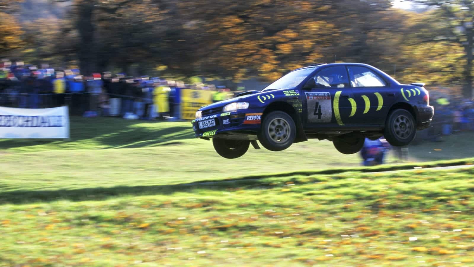 Subaru of Colin McRae in mid-air during the 1995 RAC Rally