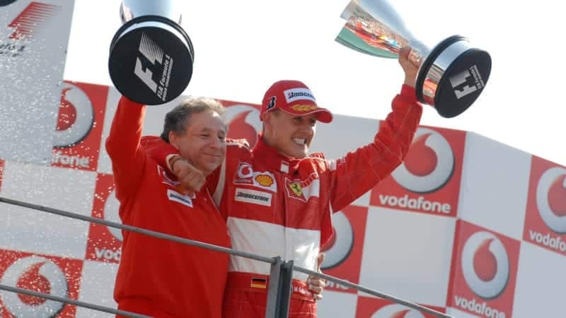 Jean Todt and Michael Schumacher with trophies in 2006