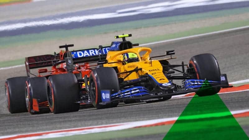 McLaren's British driver Lando Norris vies for position with Ferrari's Monegasque driver Charles Leclerc during the Bahrain Formula One Grand Prix at the Bahrain International Circuit in the city of Sakhir on March 28, 2021. (Photo by Giuseppe CACACE / AFP) (Photo by GIUSEPPE CACACE/AFP via Getty Images)